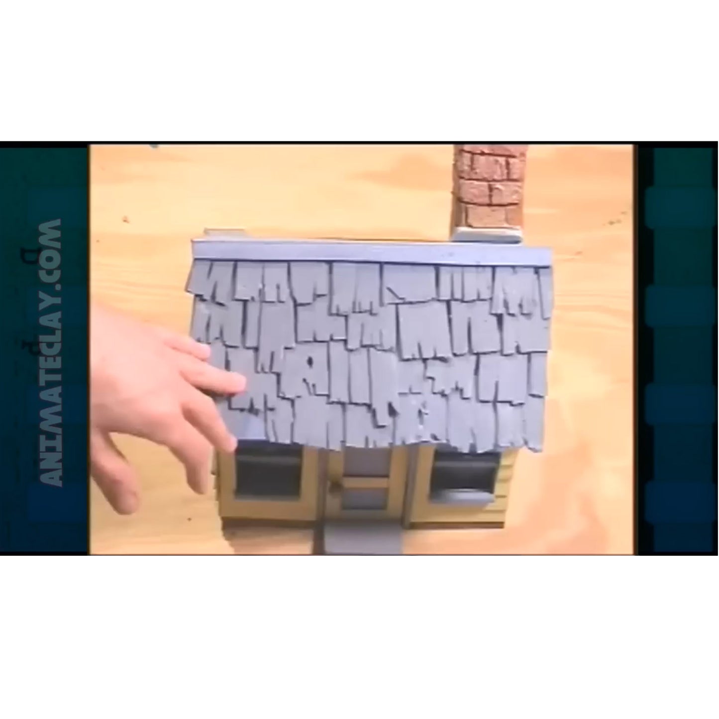 Marc shows the use of foam and balsa wood to make a house.
