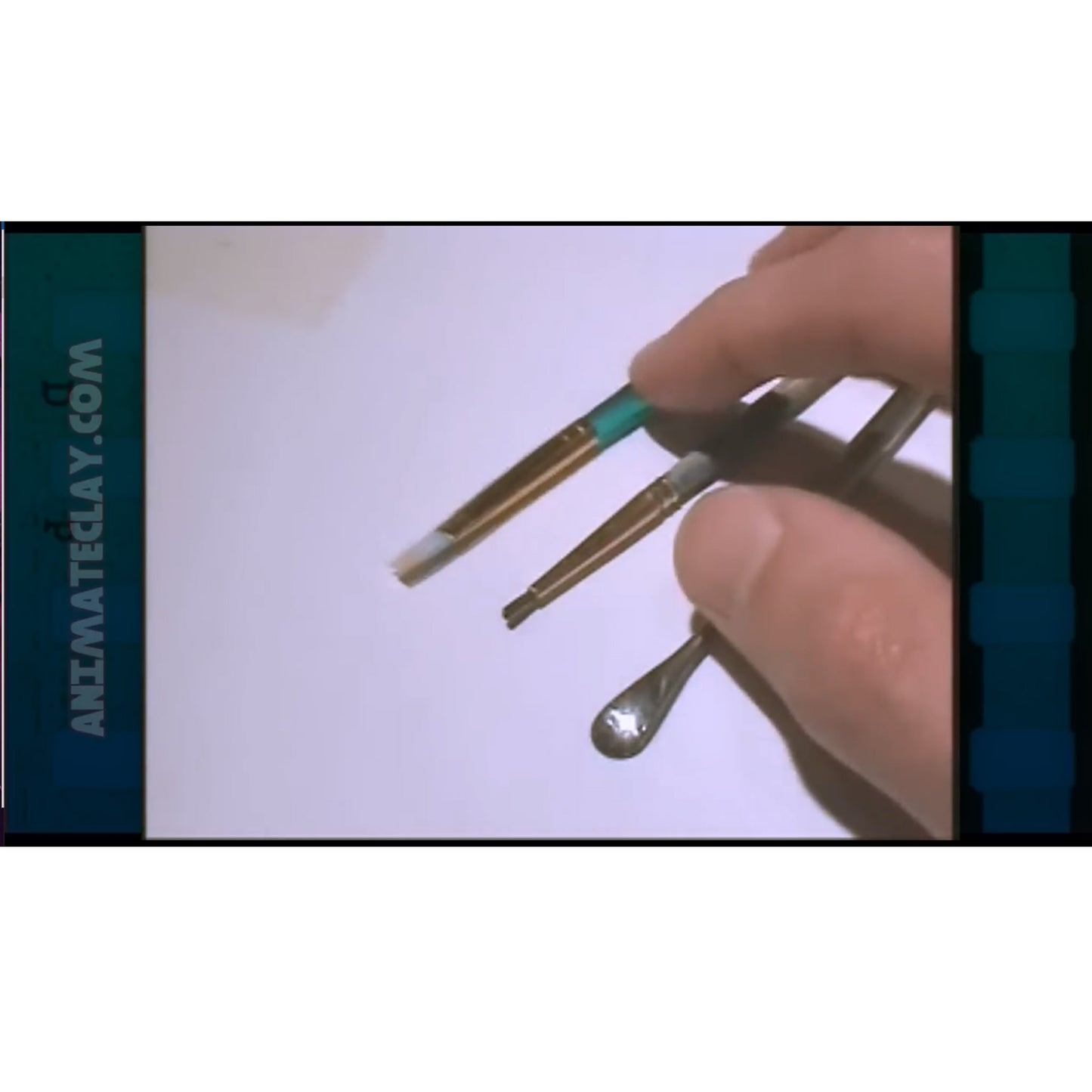 Two small brushes and a 007 wax spatula sculpting tool.
