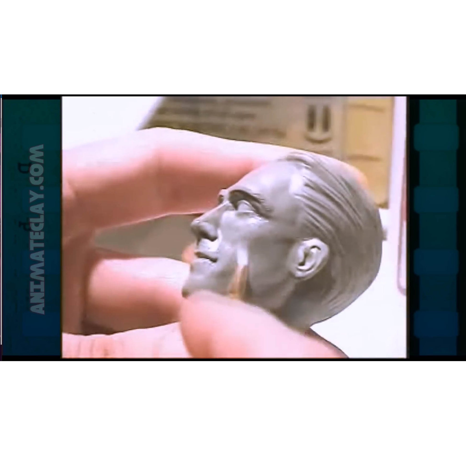 A Sculpey Firm head sculpture being smoothed.